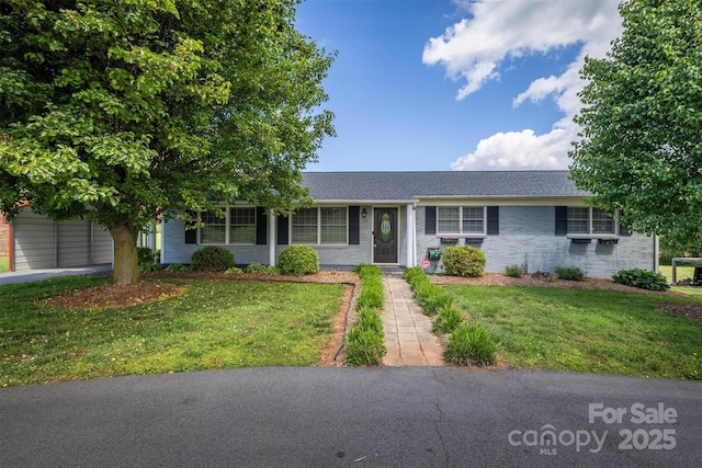 107 Pete Brittain Rd, Morganton, NC 28655 - ranch-style house featuring a front yard, brick siding, and roof with shingles