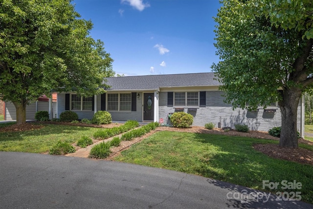 107 Pete Brittain Rd, Morganton, NC 28655 - ranch-style house featuring a front lawn and a shingled roof