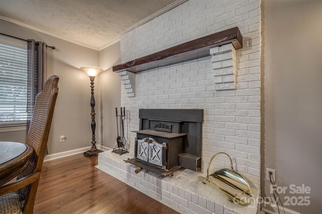 107 Pete Brittain Rd, Morganton, NC 28655 - living room featuring ornamental molding, a textured ceiling, baseboards, and wood finished floors