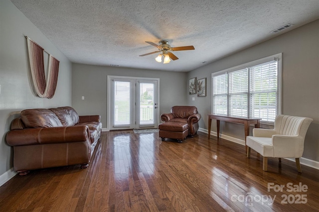 107 Pete Brittain Rd, Morganton, NC 28655 - living room featuring hardwood / wood-style flooring, baseboards, ceiling fan, and a textured ceiling