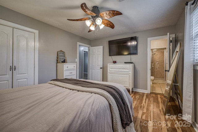 107 Pete Brittain Rd, Morganton, NC 28655 - bedroom with wood finished floors, a closet, baseboards, ceiling fan, and ensuite bathroom