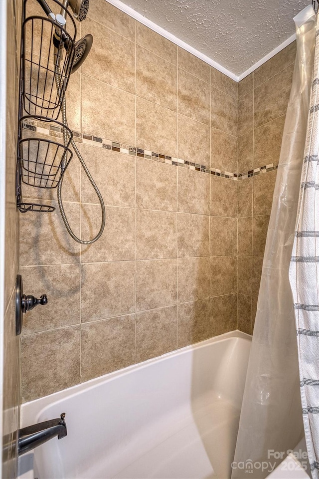 107 Pete Brittain Rd, Morganton, NC 28655 - full bath featuring shower / bath combo with shower curtain, a textured ceiling, and ornamental molding