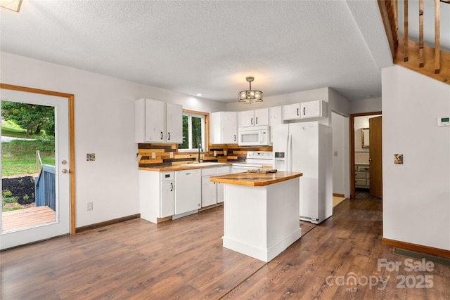 234 Snyder Farm Rd, Waynesville, NC 28786 - kitchen with white appliances, wood counters, a sink, white cabinets, and baseboards