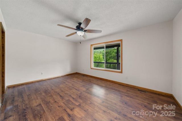 234 Snyder Farm Rd, Waynesville, NC 28786 - spare room with a ceiling fan, baseboards, wood finished floors, and a textured ceiling