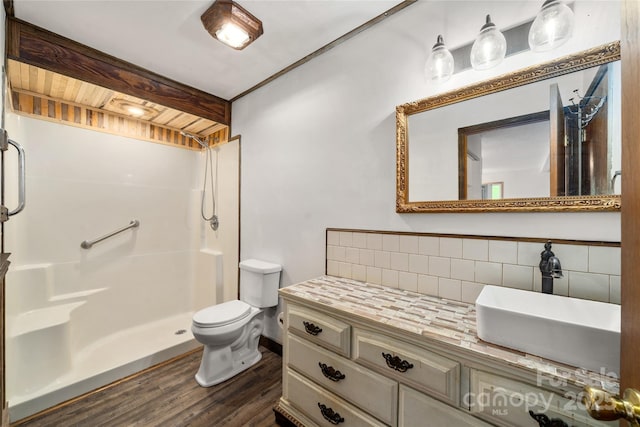 234 Snyder Farm Rd, Waynesville, NC 28786 - full bath with decorative backsplash, wood finished floors, a shower stall, toilet, and vanity