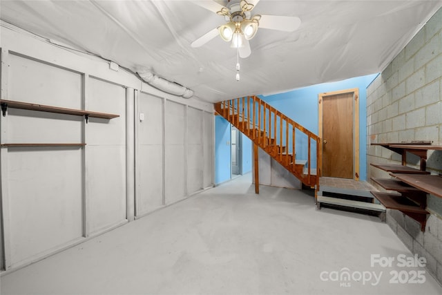 234 Snyder Farm Rd, Waynesville, NC 28786 - basement featuring stairs, concrete block wall, and a ceiling fan
