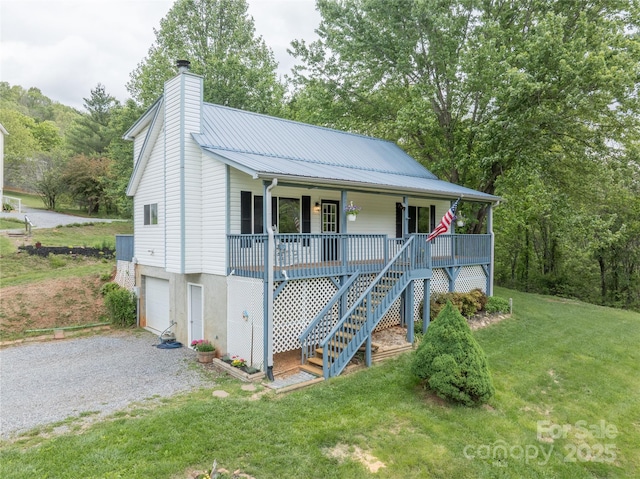 234 Snyder Farm Rd, Waynesville, NC 28786 - view of front facade with a porch, an attached garage, driveway, a chimney, and a front yard