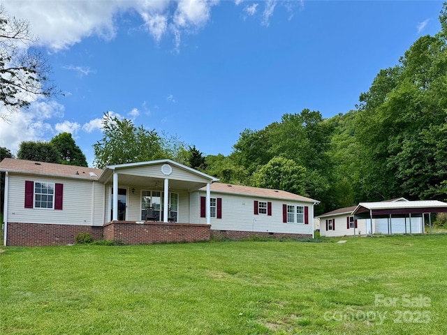 40 Mountainview Rd, Asheville, NC 28806 - view of front of property featuring crawl space, a front yard, a porch, and a detached garage