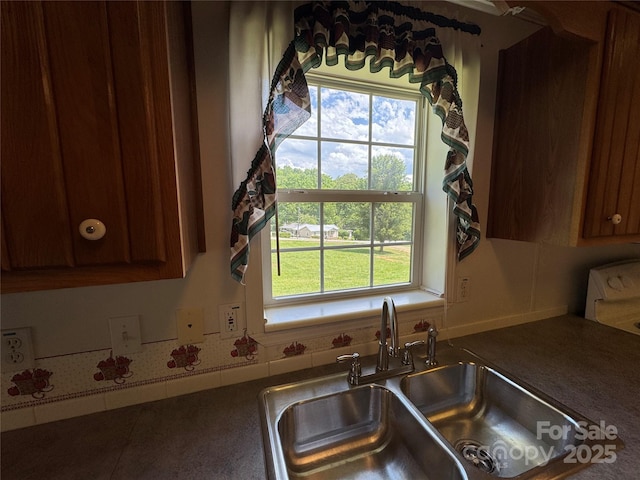 40 Mountainview Rd, Asheville, NC 28806 - kitchen with a sink, dark countertops, and brown cabinets