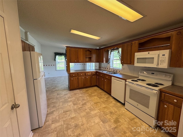 40 Mountainview Rd, Asheville, NC 28806 - kitchen featuring white appliances, open shelves, a sink, dark countertops, and plenty of natural light
