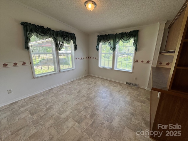 40 Mountainview Rd, Asheville, NC 28806 - empty room with a textured ceiling, stone finish floors, and baseboards
