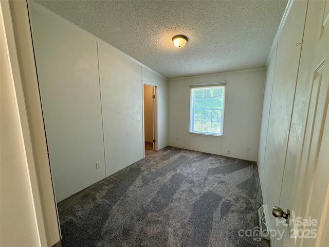 40 Mountainview Rd, Asheville, NC 28806 - unfurnished bedroom with ornamental molding, carpet flooring, and a textured ceiling