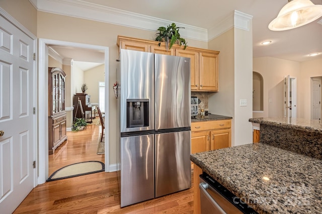 7245 Willow Brook Ct, Denver, NC 28037 - kitchen with stainless steel fridge, light wood-style flooring, light brown cabinets, ornamental molding, and dark stone counters