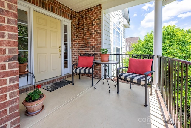 7245 Willow Brook Ct, Denver, NC 28037 - doorway to property with brick siding and a porch