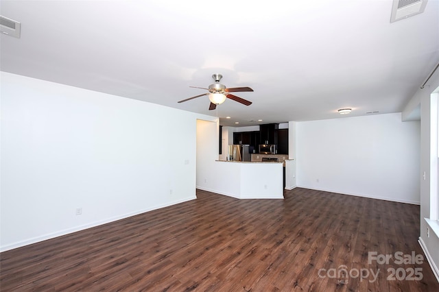 unfurnished living room featuring dark wood-style floors, a ceiling fan, baseboards, and recessed lighting
