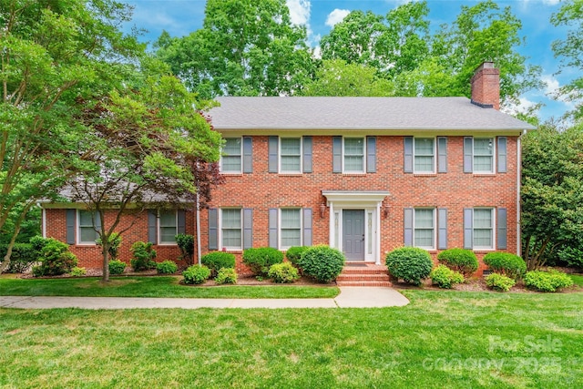 2730 Tiffany Dr, Rock Hill, SC 29732 - colonial inspired home with a chimney, a front yard, and brick siding