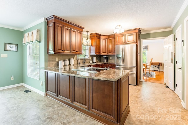 2730 Tiffany Dr, Rock Hill, SC 29732 - kitchen featuring stainless steel appliances, light stone counters, a peninsula, tasteful backsplash, and ornamental molding