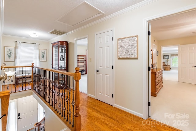 2730 Tiffany Dr, Rock Hill, SC 29732 - hall featuring an upstairs landing, attic access, crown molding, and light wood-style flooring