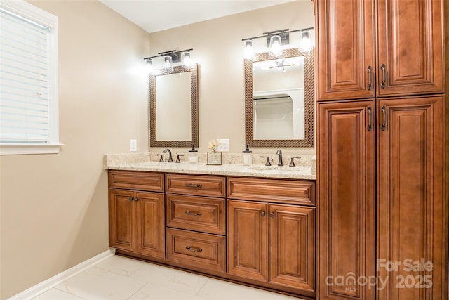 2730 Tiffany Dr, Rock Hill, SC 29732 - bathroom with marble look tiles, double vanity, and baseboards