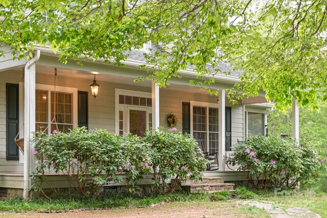4398 Mud Puddle Ln, Lenoir, NC 28645 - back of property with covered porch and roof with shingles