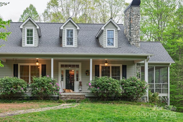 4398 Mud Puddle Ln, Lenoir, NC 28645 - cape cod-style house with a chimney, a shingled roof, a front yard, a sunroom, and covered porch