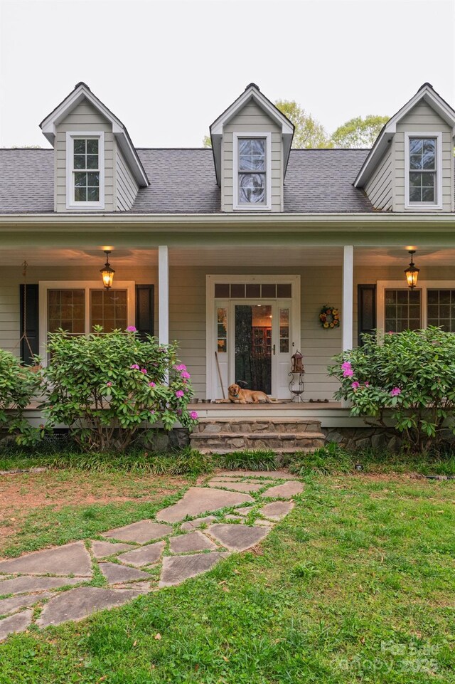 4398 Mud Puddle Ln, Lenoir, NC 28645 - view of exterior entry with a porch, a lawn, and roof with shingles