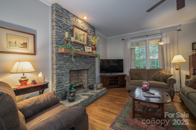 4398 Mud Puddle Ln, Lenoir, NC 28645 - living room featuring crown molding, wood finished floors, a ceiling fan, and a fireplace