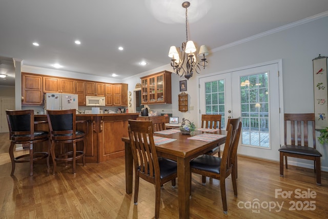 4398 Mud Puddle Ln, Lenoir, NC 28645 - dining room featuring crown molding, light wood-style floors, a chandelier, and recessed lighting