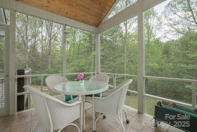 4398 Mud Puddle Ln, Lenoir, NC 28645 - sunroom / solarium featuring outdoor dining area, a wooded view, and vaulted ceiling