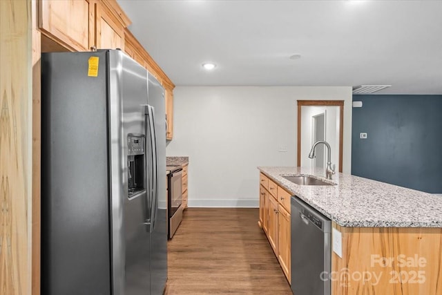 200 Mosley Rd, Blacksburg, SC 29702 - kitchen featuring stainless steel appliances, a sink, dark wood-style floors, baseboards, and light stone counters