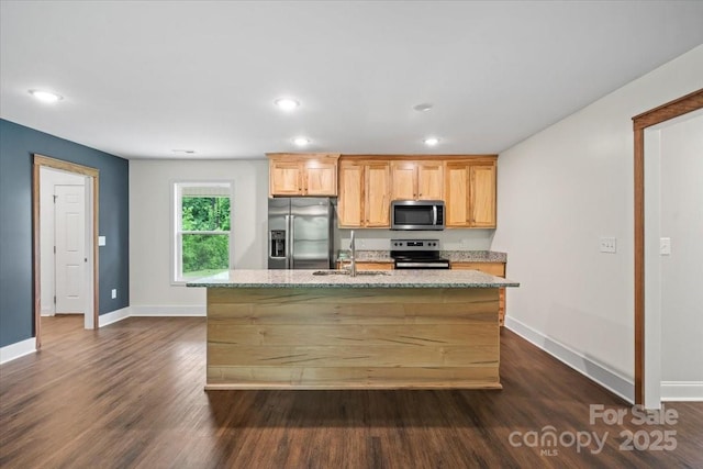 200 Mosley Rd, Blacksburg, SC 29702 - kitchen with appliances with stainless steel finishes, a sink, baseboards, dark wood-type flooring, and a center island with sink