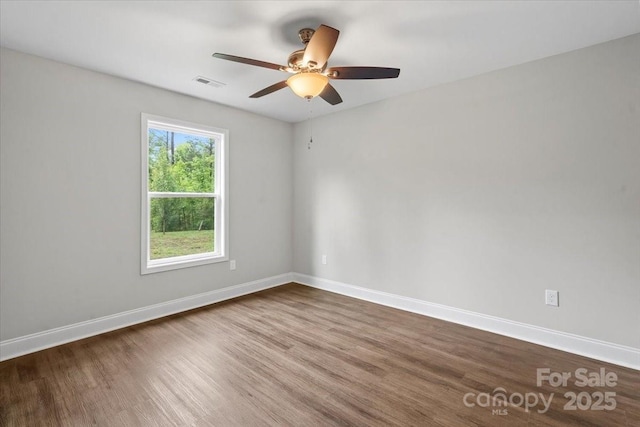 200 Mosley Rd, Blacksburg, SC 29702 - spare room featuring dark wood-style floors, a ceiling fan, and baseboards