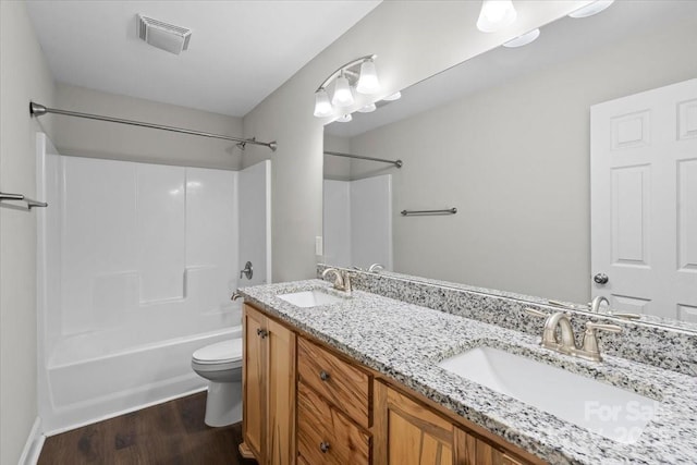 200 Mosley Rd, Blacksburg, SC 29702 - bathroom featuring toilet, shower / bathtub combination, double vanity, and wood finished floors