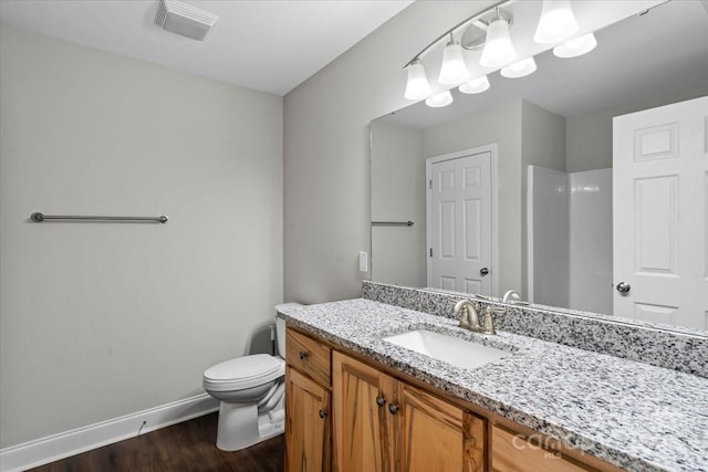 200 Mosley Rd, Blacksburg, SC 29702 - bathroom featuring vanity, toilet, wood finished floors, baseboards, and a shower