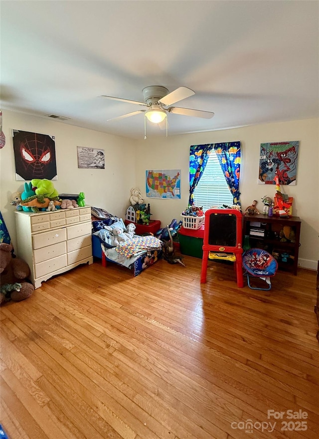 bedroom featuring light wood-type flooring and ceiling fan