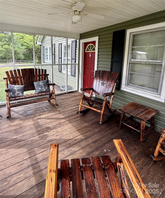 wooden terrace featuring ceiling fan