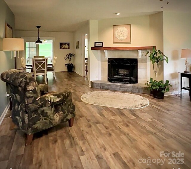 423 Cad Campbell Rd, Bakersville, NC 28705 - living area featuring wood finished floors, a tile fireplace, and recessed lighting
