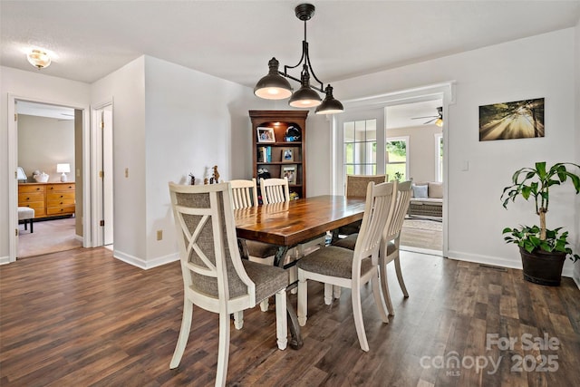 423 Cad Campbell Rd, Bakersville, NC 28705 - dining area featuring dark wood-style flooring and a ceiling fan