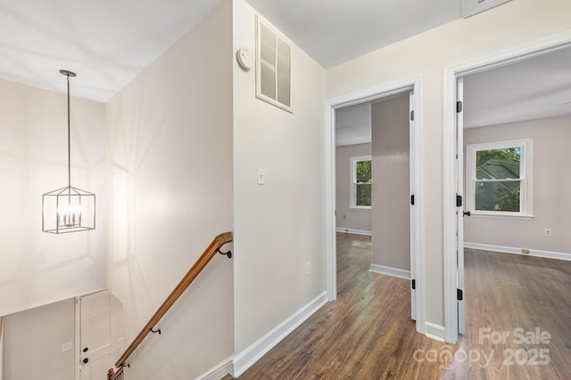 3101 Willowbrae Rd, Charlotte, NC 28226 - corridor with an upstairs landing, dark wood-type flooring, baseboards, and a chandelier