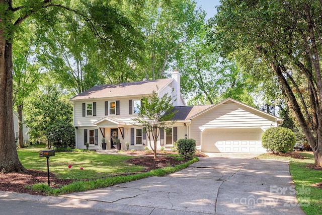 3101 Willowbrae Rd, Charlotte, NC 28226 - view of front of home with a garage, driveway, a front lawn, and a chimney