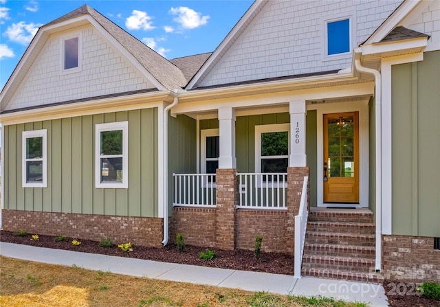 LOT101 Coppergate Dr, Salisbury, NC 28147 - doorway to property with board and batten siding, covered porch, and brick siding