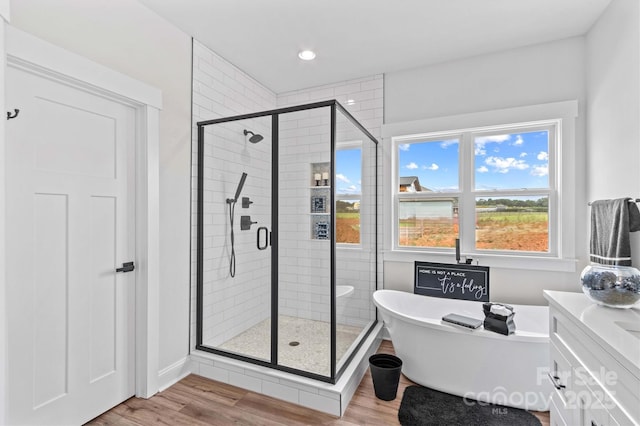 LOT101 Coppergate Dr, Salisbury, NC 28147 - bathroom featuring a freestanding bath, a shower stall, wood finished floors, vanity, and recessed lighting