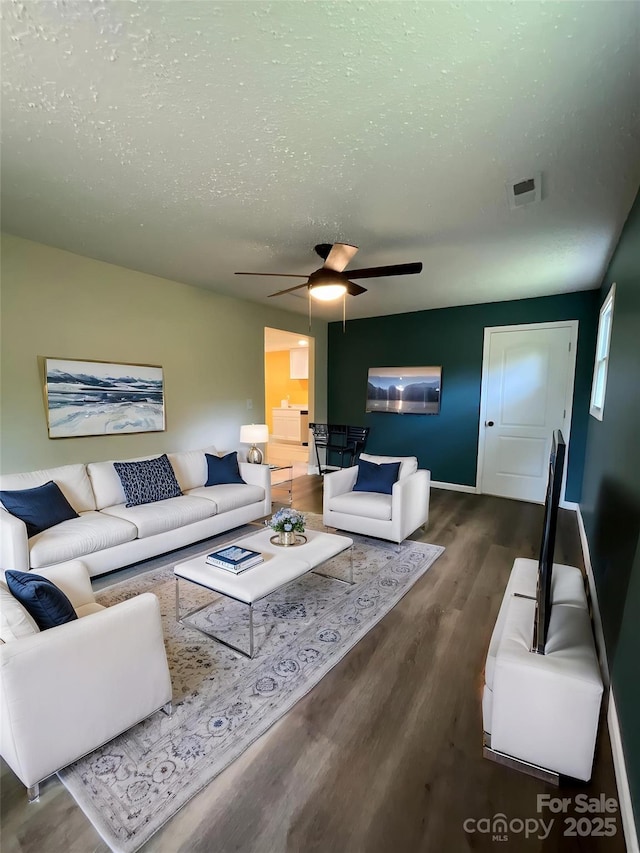 152 Mountainview St, Forest City, NC 28043 - living area featuring wood finished floors, a ceiling fan, and baseboards