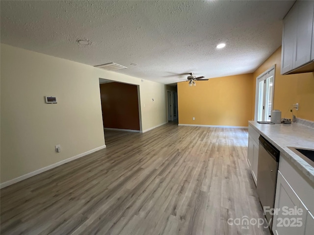 152 Mountainview St, Forest City, NC 28043 - unfurnished living room featuring a textured ceiling, light wood-style floors, a ceiling fan, baseboards, and recessed lighting