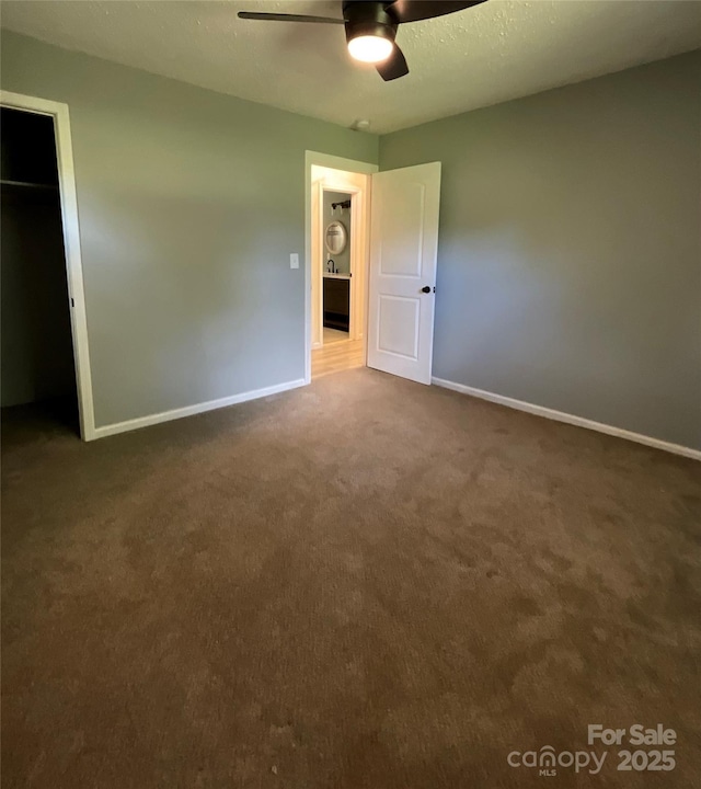 152 Mountainview St, Forest City, NC 28043 - unfurnished bedroom with carpet flooring, baseboards, ceiling fan, and a closet