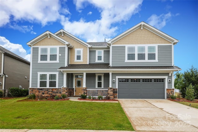 1119 Bellshill Dr, Indian Trail, NC 28079 - craftsman-style house with covered porch, stone siding, a garage, a front lawn, and driveway