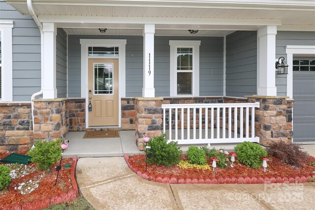 1119 Bellshill Dr, Indian Trail, NC 28079 - property entrance featuring a porch and stone siding