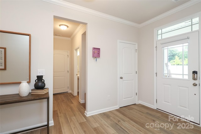 1119 Bellshill Dr, Indian Trail, NC 28079 - foyer entrance with light wood-type flooring, crown molding, and baseboards