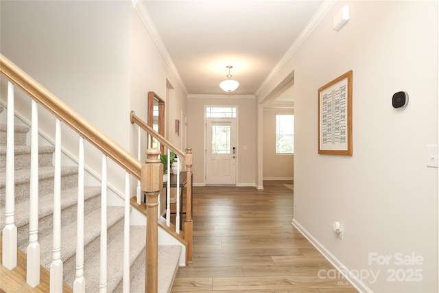 1119 Bellshill Dr, Indian Trail, NC 28079 - foyer entrance featuring crown molding, light wood-type flooring, stairs, and baseboards
