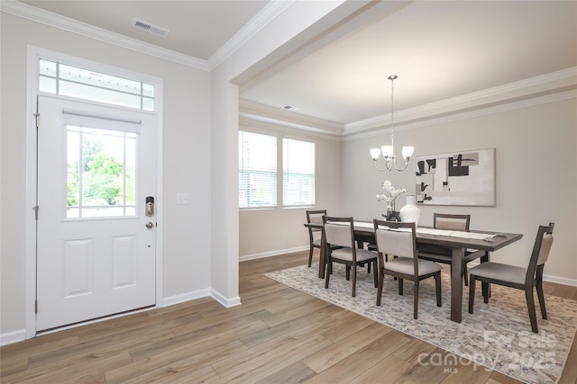 1119 Bellshill Dr, Indian Trail, NC 28079 - dining area with light wood-style floors, baseboards, a chandelier, and crown molding